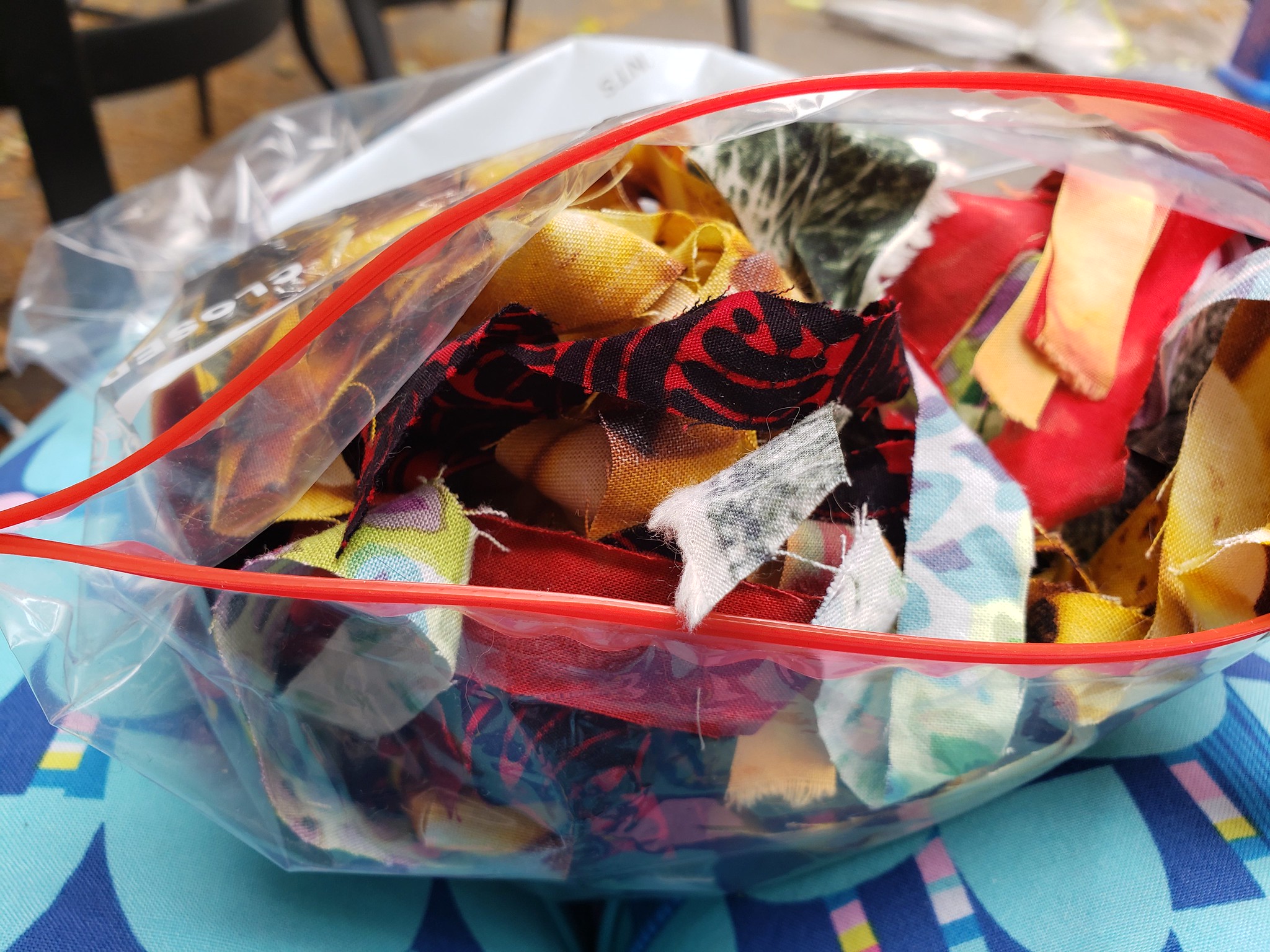 A bag of colorful fabric strips.