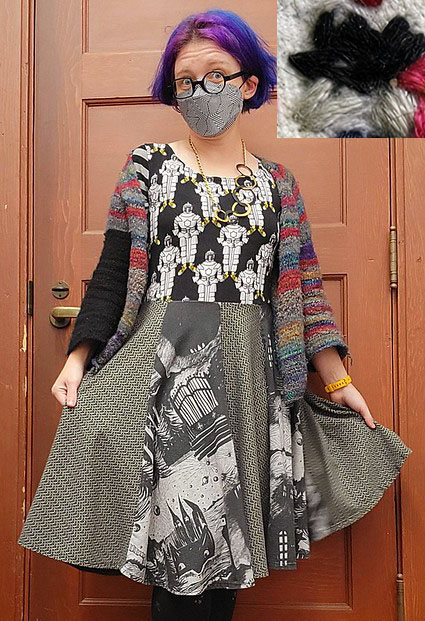 Quinn in a chained book themed dress, with medieval chains and a horror theme and some knights with tennis shoes, and a gray/black filled in star